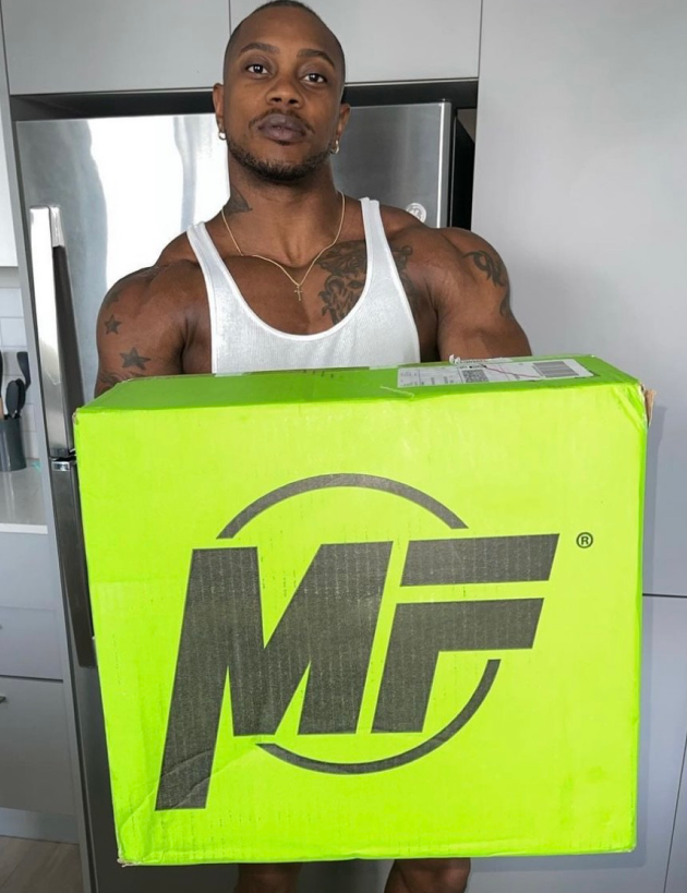 Athlete Brandon Hendrickson with MegaFit Meals box